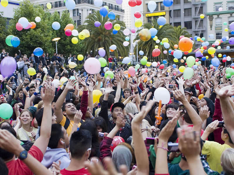 students-throwing-balloons-in-air