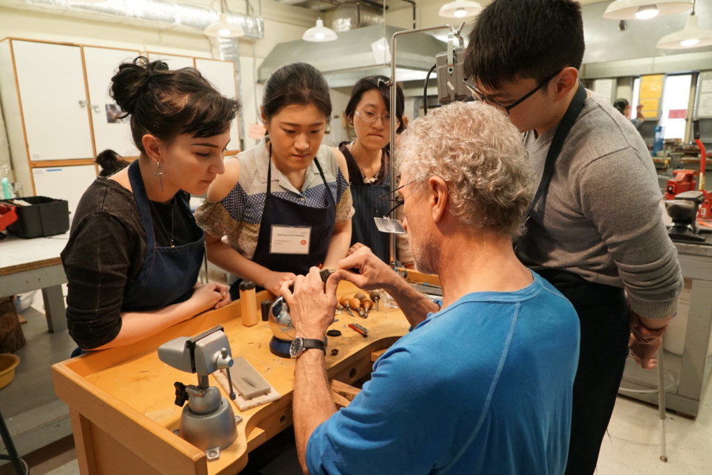 Professor demonstrating jewelry and metal arts techniques