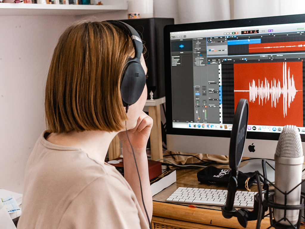 student using her home studio while learning online